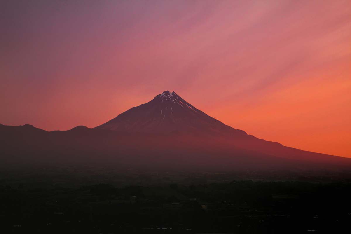 mountain mountain surrounded by clouds paritutu